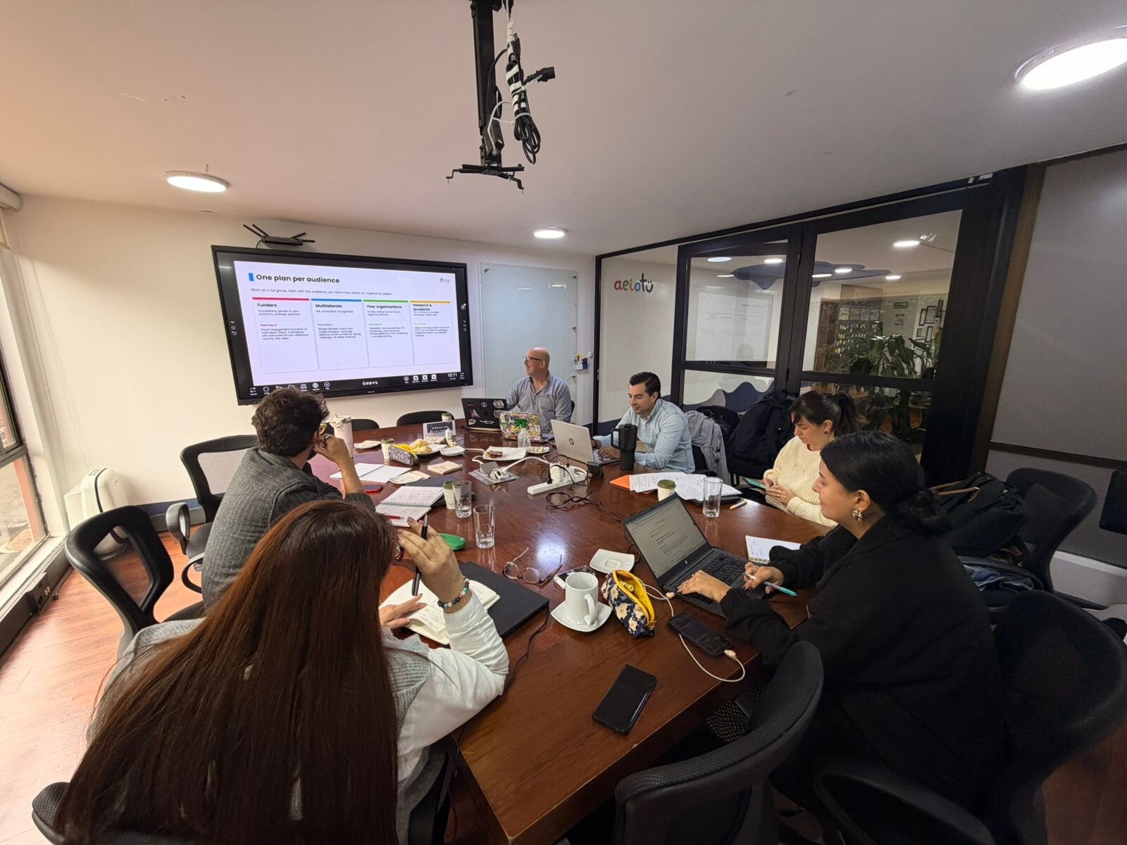 The aeioTU leadership team working through audience plans during the Strategic Narrative Workshop
